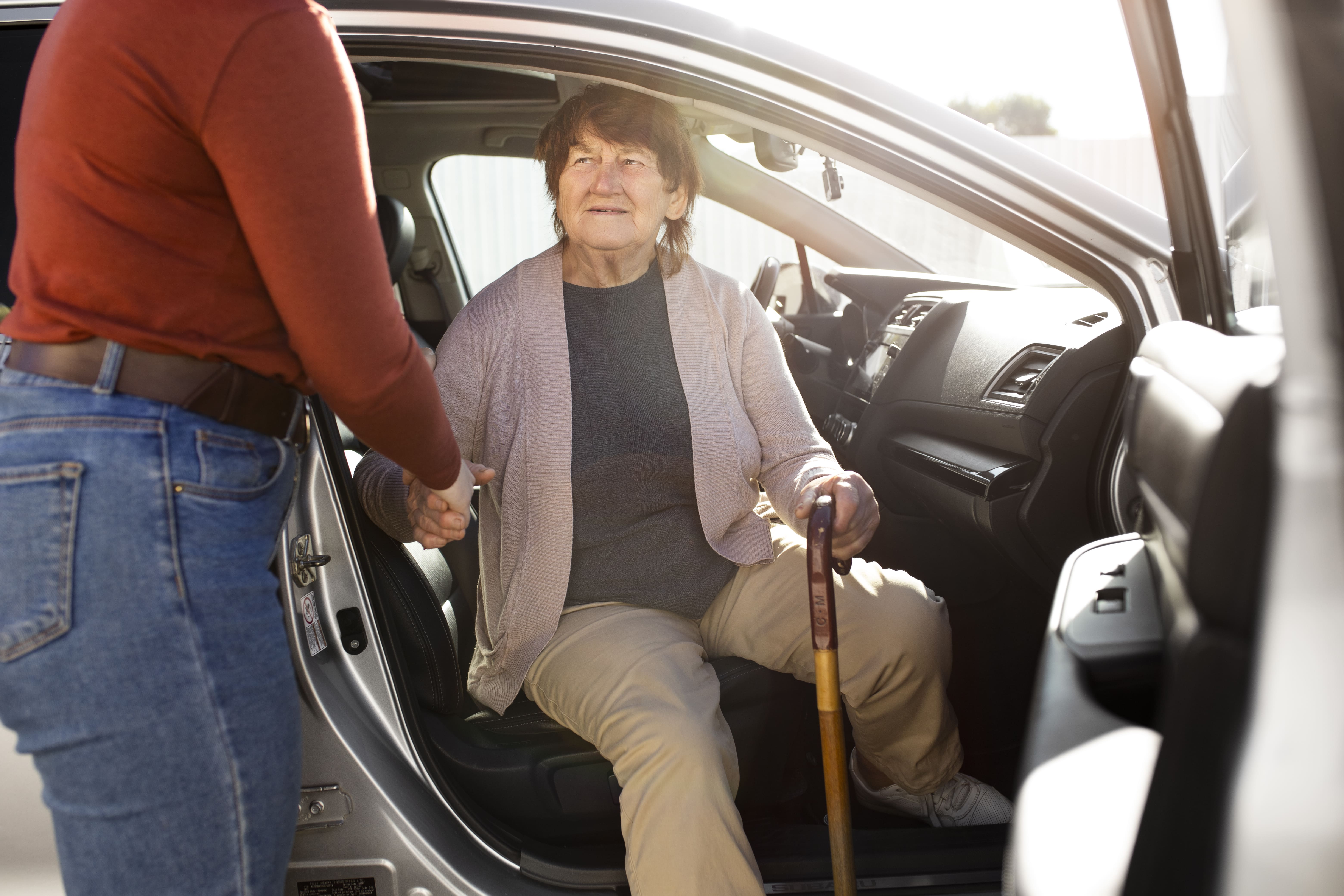 person helping their elder neighbour 2